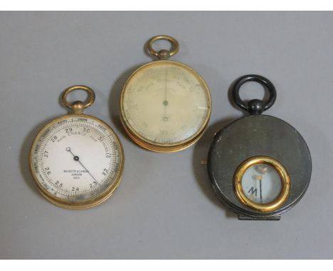 A Negretti and Zambra, London, pocket aneroid barometer, with silvered dial and lacquered brass case, a similar barometer sig