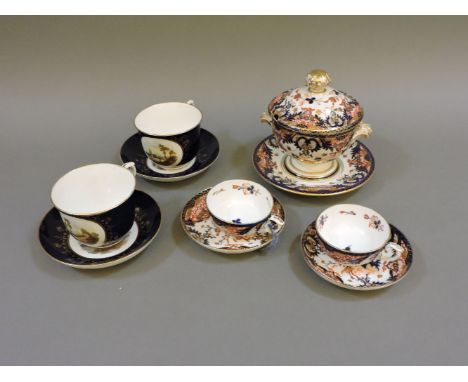 A collection of Derby table wares, a tureen, cover and stand, a pair of cups and saucers, and another pair of chocolate cups 