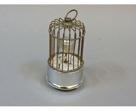 A mid 20th century German Kaiser orbital bird cage clock, keyless wind alarm function movement, orbital style display with Ar