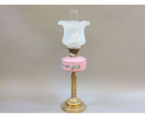 A Victorian oil lamp, with a Duplex burner, opaline glass shade, with a painted pink reservoir, 68cm high