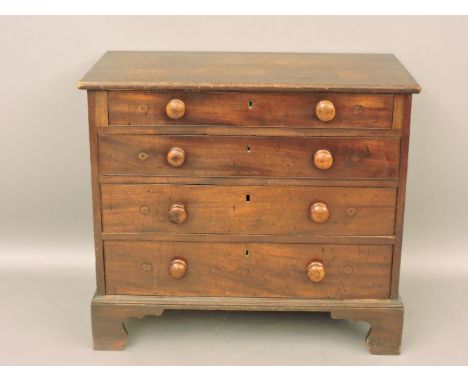 A George III mahogany bachelor's chest, with later top, oak drawer linings, on bracket feet, 88.5cm wide, 48cm deep, 77cm hig