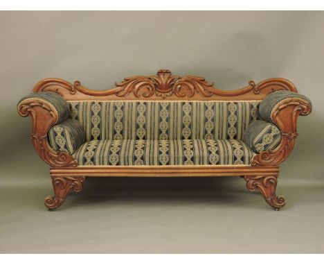 A William IV mahogany frame sofa, with acanthus leaf moulded pediment, scroll arms and feet, reupholstered in a striped fabri