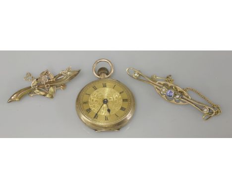 A Victorian gold sapphire and seed pearl brooch, marked 9ct with a safety chain, a gold heart and forget-me-knot brooch, mark