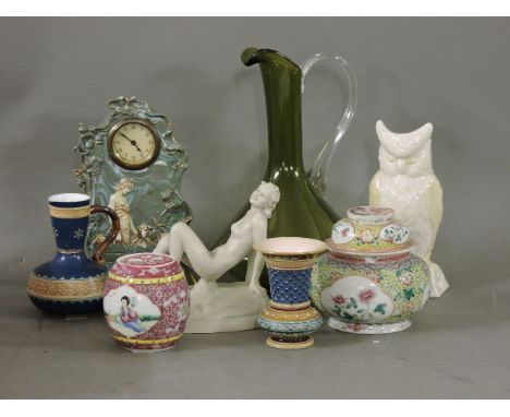 A small number of ceramics, including a Belleek owl, a nude lady, a 'shepherdess' clock, and a green glass jug