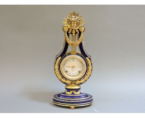 A reproduction 'Marie Antoinette' china and gilt metal mounted mantel clock, 39cm tall
