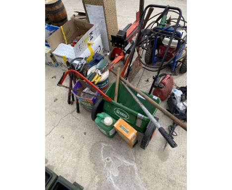 AN ASSORTMENT OF GARDEN TOOLS TO INCLUDE A SEEDER, SAWS AND FENCE PAINT ETC 