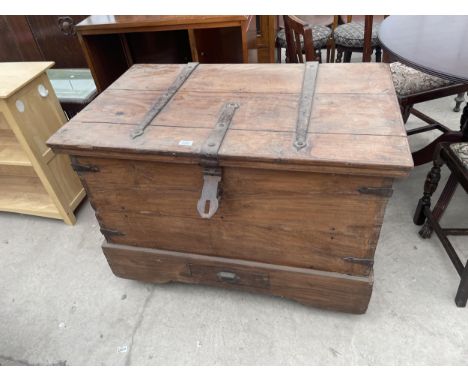 A VINTAGE INDIAN HARDWOOD DOWRY CHEST WITH METAL HINGES AND LOWER DRAWER 24 X 29" 