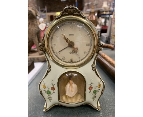 MANTLE CLOCK WITH ALARM IN PALE GREEN WITH FLORAL DECORATION AND A BALLERINA FIGURE HEIGHT 15CM 