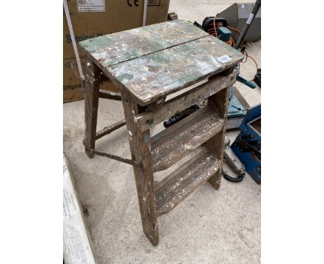 A VINTAGE WOODEN TWO RUNG STEP LADDER 
