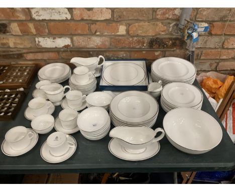 A ROYAL DOULTON 'SILVER JUBILEE' DINNER SERVICE TO INCLUDE VARIOUS SIZES OF PLATES, BOWLS, SAUCE BOATS AND SAUCERS, CREAM JUG