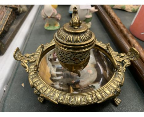 A BRASS INKWELL WITH A CERAMIC BASE 