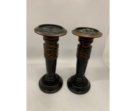 A PAIR OF VINTAGE WOODEN CANDLESTICKS 