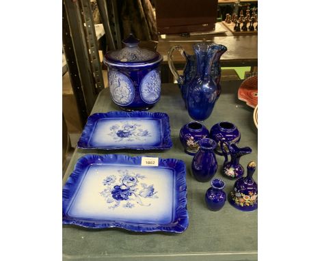 A COLLECTION OF VINTAGE BLUE CERAMIC ITEMS - CONTINENTAL LIDDED BISCUIT JAR, BLUE GLASS ETC 