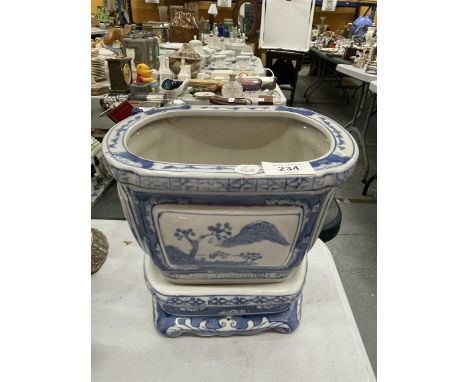 A MODERN CHINESE BLUE AND WHITE PLANTER ON STAND 