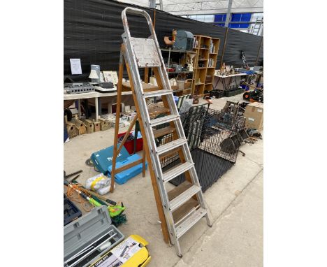 A SIX RUNG ALUMINIUM STEP LADDER AND A FURTHER SIX RUNG WOODEN STEP LADDER 