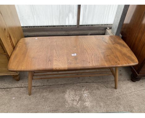 A BLONDE ERCOL COFFEE TABLE WITH SLATTED SHELF, 41 X 18" 