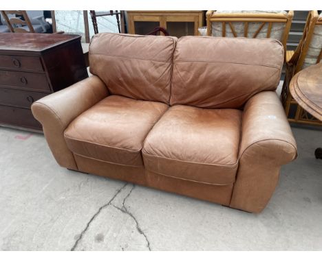 A LEATHER VIOLINO TWO SEATER SOFA 