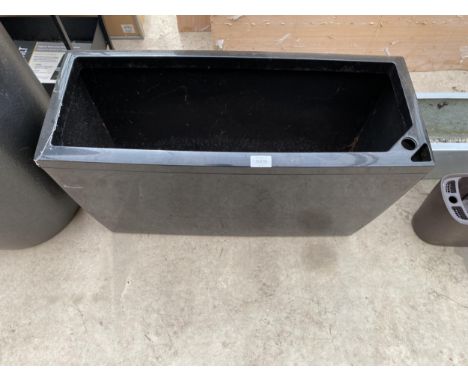 A LOW BLACK FIBRE GLASS TROUGH PLANTER (L:75CM H:43CM) 