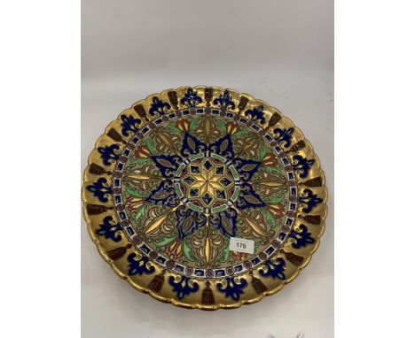 A LARGE VINTAGE COLOURFUL ENAMEL DESIGN CHARGER 