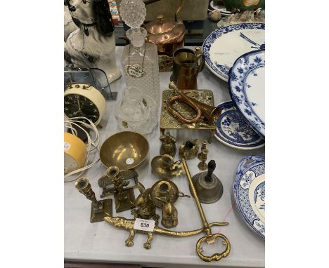 A LARGE QUANTITY OF COPPER AND BRASS ITEMS TO INCLUDE A KETTLE, CANDLESTICKS, A BELL, SMALL BUGLE, TRIVET STAND, ANIMALS, PLU