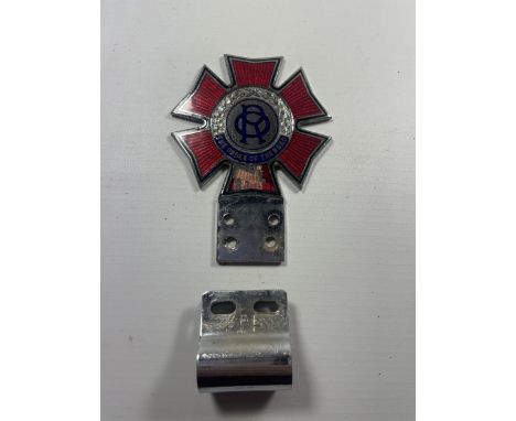 A VINTAGE ENAMEL ORDER OF THE ROAD BUMPER BADGE WITH CLIP 