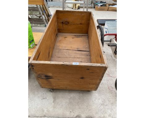 A LARGE VINTAGE WOODEN FOUR WHEELED TROLLEY 