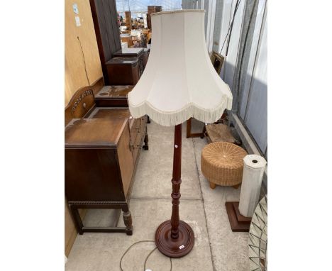A MODERN STANDARD LAMP COMPLETE WITH SHADE ON TURNED AND FLUTED COLUMN 