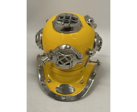 A SMALL YELLOW METAL DIVERS HELMET, HEIGHT 19CM 