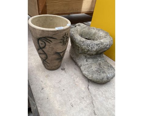 A RECONSTITUTED STONE BOOT PLANTER AND A FURTHER PLANT POT 