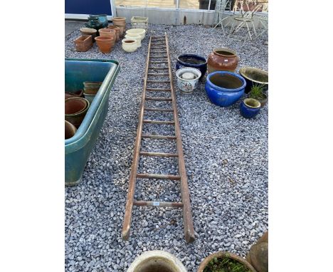 A VINTAGE WOODEN 18 RUNG LADDER 