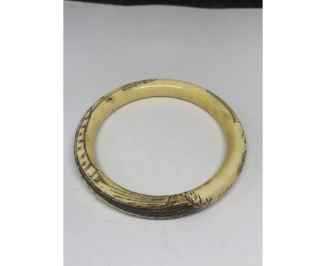 AN ORIENTAL BONE BANGLE 