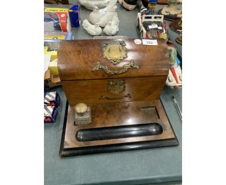 A VINTAGE WALNUT DESK STAND WITH BRASS FITTINGS 