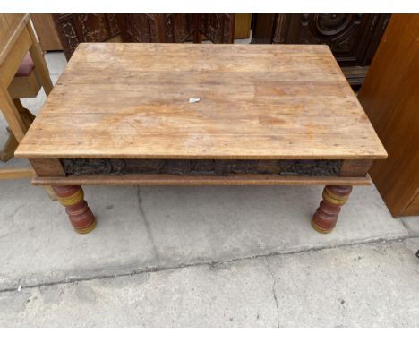 A VINTAGE INIDAN HARDWOOD COFFEE TABLE WITH CARVED DECORATION AND TURNED AND PAINTED LEGS, 46X29.5" 