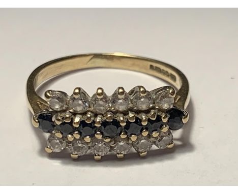 A 9 CARAT GOLD RING WITH TEN SAPPHIRES AND TWELVE CUBIC ZIRCONIAS SIZE K/L 