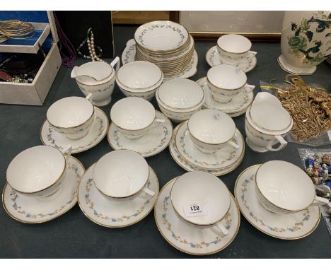 A MINTON 'CHAMPAGNE' TEASET TO INCLUDE A CAKE PLATE, CUPS, SAUCERS, SIDE PLATES, TWO CREAM JUGS AND TWO SUGAR BASINS 