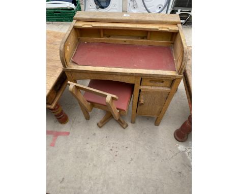 A VINTAGE PINE ROLL TOP SCHOOL DESK AND MATCHING CHAIR 