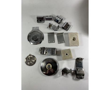 A QUANTITY OF BRACKETS FOR CAR BADGES, A VINTAGE TAX DISC HOLDER, ETC 
