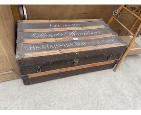 A VINTAGE MILITARY TRAVELLING TRUNK WITH WOODEN SUPPORTS, HOTSPUR 