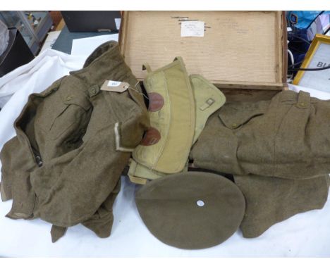 A BRITISH ARMY CORPORALS BATTLEDRESS, DATED 1946 AND A SUITCASE 