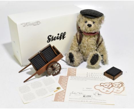 STEIFF; a limited edition Coal Carrier teddy bear, number 00417, with certificate and cart.
