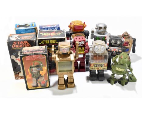 A collection of tin plate and mechanical robots including battery operated moon explorer, action robot, battery operated star