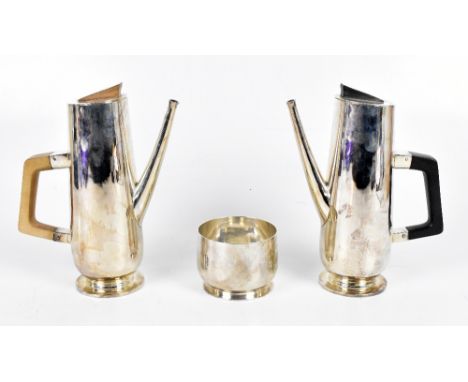 H. BROWN; an Elizabeth II stylish pair of hallmarked silver coffee pots with angled finials above concealed hinge angular woo