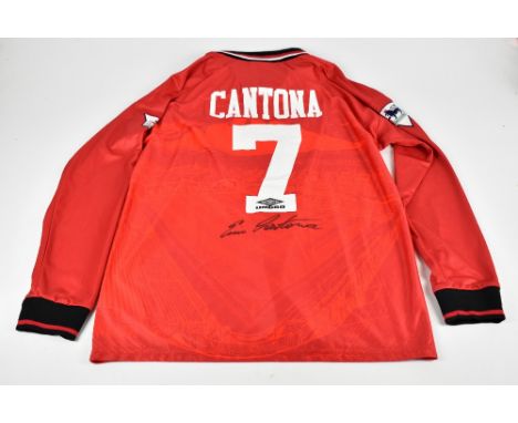 ERIC CANTONA; an Umbro Manchester United 1994-96 season retro reproduction home shirt, signed with ‘Cantona 7’ to reverse, si