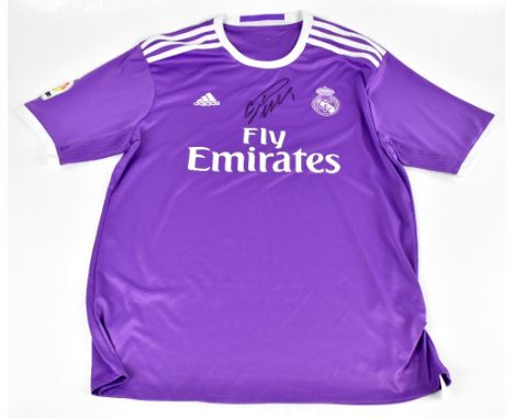 CRISTIANO RONALDO; an Adidas Real Madrid purple shirt, signed to front, size XL.
Additional InformationCreasing and light gen