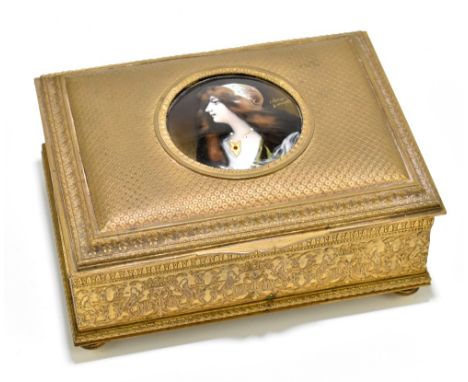 LEBRUN FOR LIMOGES; a gilt metal rectangular casket, the hinged lid centred with a circular enamelled plaque painted with the