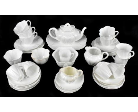 SHELLEY; a 'Dainty' pattern part tea service, together with further ceramics, including a Carlton ware money box, etc.Additio