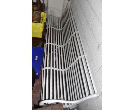 RAILWAY INTEREST; a good and large 19th century wrought iron slat back bench with scrolling arms, length 245cm.N.B. Formerly 