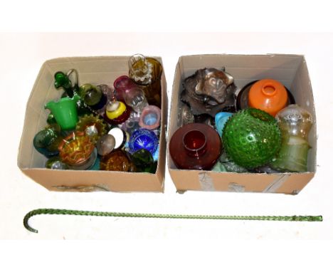 A large quantity of decorative predominantly coloured glass including a pale green tinted walking stick, carnival glass, etc.