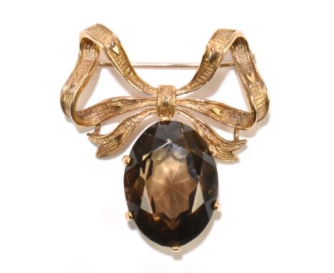 A 9ct yellow gold bow brooch suspending a smoky quartz pendant drop, width 35mm, approx 10g.Additional InformationSome very l