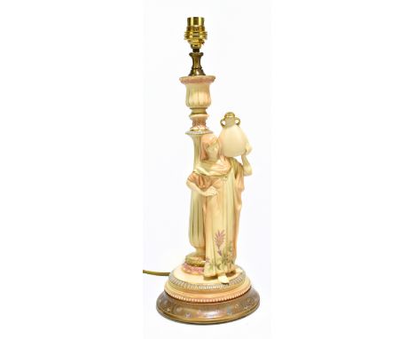 ROYAL WORCESTER; a blush ivory figural table lamp modelled as a female water carrier, raised on painted wooden plinth base, o